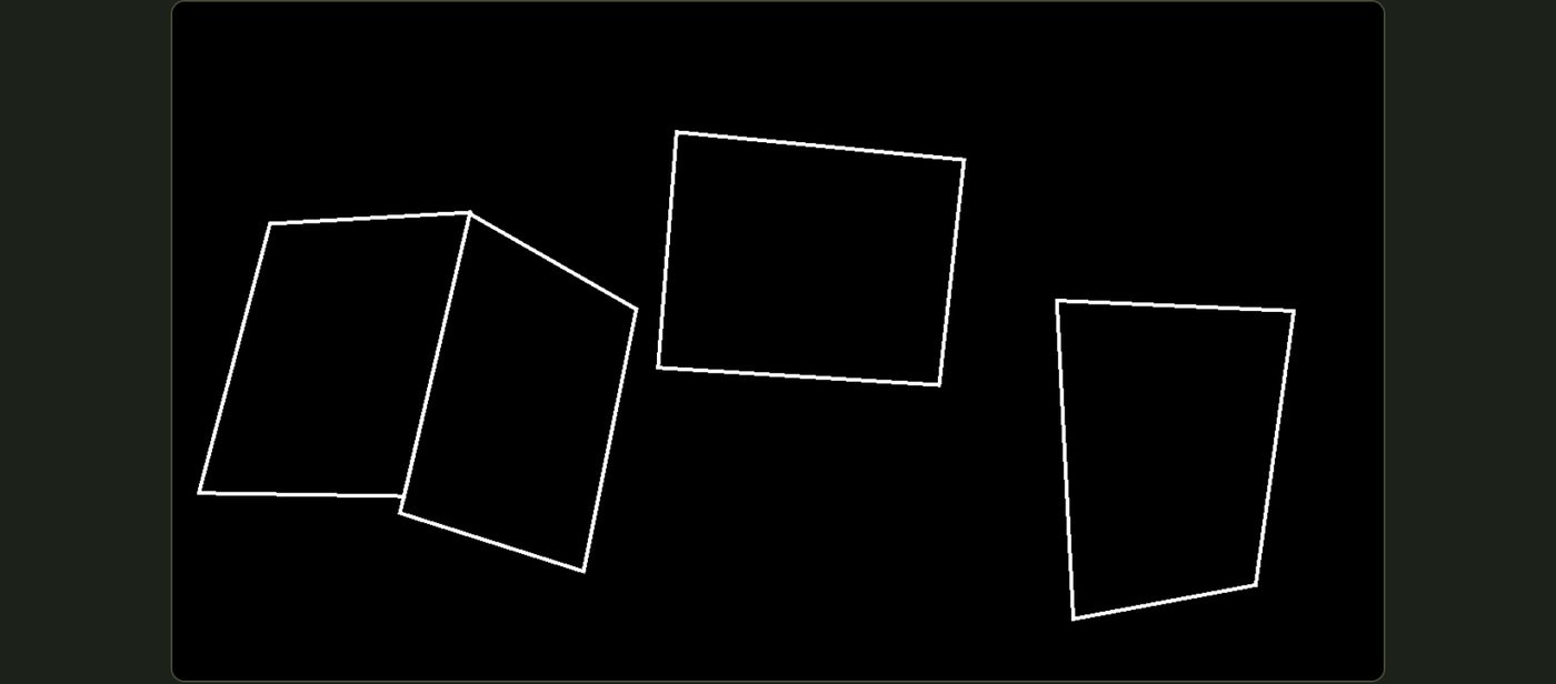 The projector showing white outlines of the four chosen objects on black